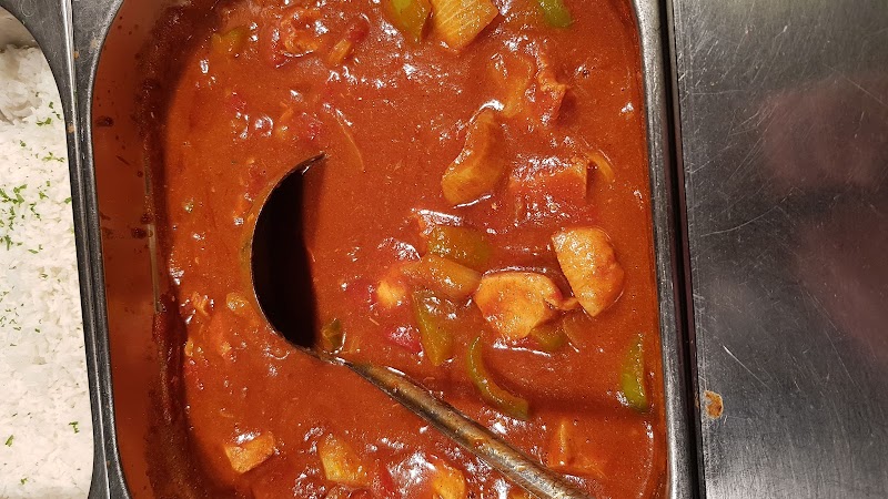 Rich tomato and chicken stew, slow-cooked in the Gallahues kitchen